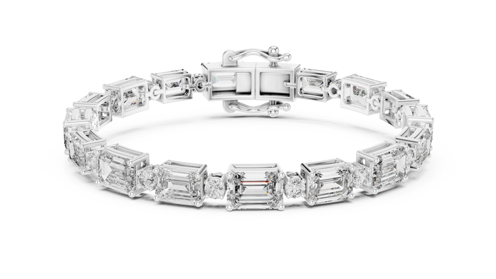 Claw-set emerald and round lab-grown diamond bracelet in white gold by THE LAB Jewellers